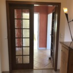 App. 2 Flur Blick Richtung Schlafzimmer 1 + 2 hinter der Glastür. Links vor der Türe ist das Bad